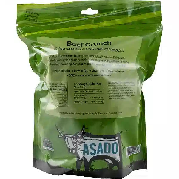 Green package of Asado Beef Crunch snacks for dogs on a white background