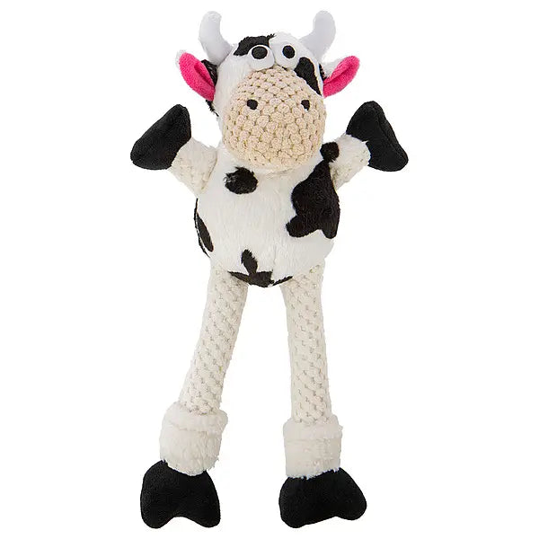 Knitted cow toy with black and white pattern on a white background