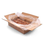 Cardboard box with plastic wrap containing raw dog food on a white background
