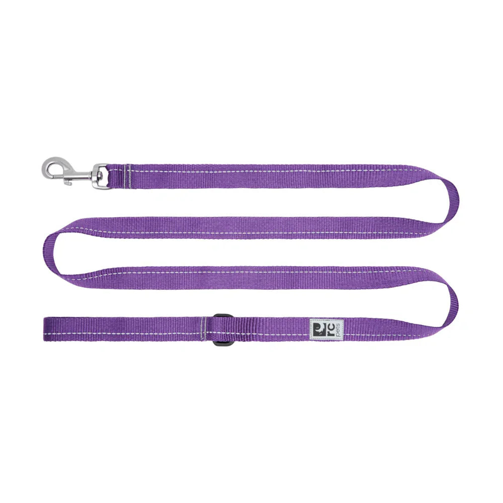 Purple dog leash with a clip on a white background