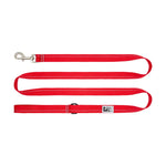 Red dog leash with a metal clip on a white background